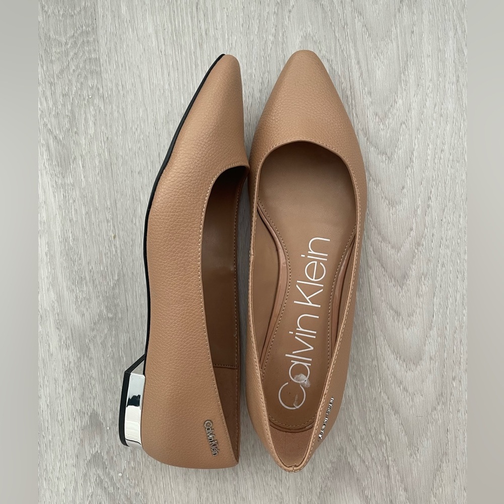 Brand new | Nude Calvin Klein flats with chrome around the heel
